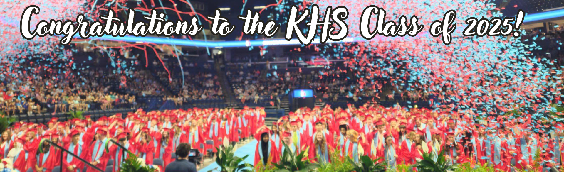 a picture containing KHS graduates in red robes and caps with confetti in the air Congratulations to the KHS Class of 2025